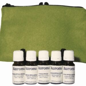 Five small bottles of Auromère Ayurvedic toothpaste in front of a green pouch.